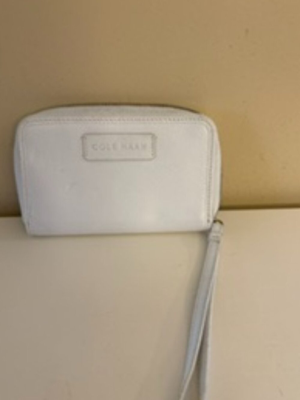 Cole Haan small white pebbled wristlet